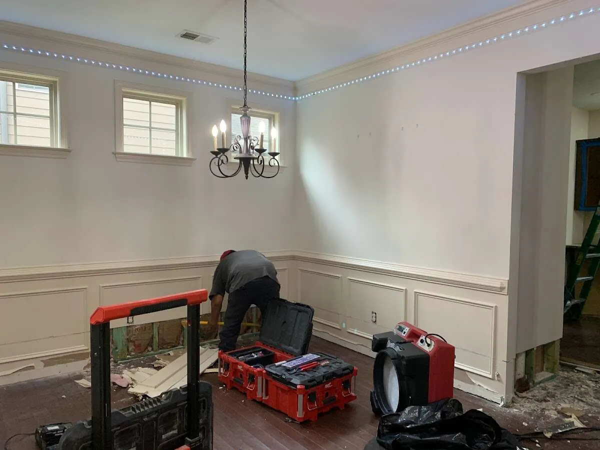Restoration technician with professional equipment in Glens Falls